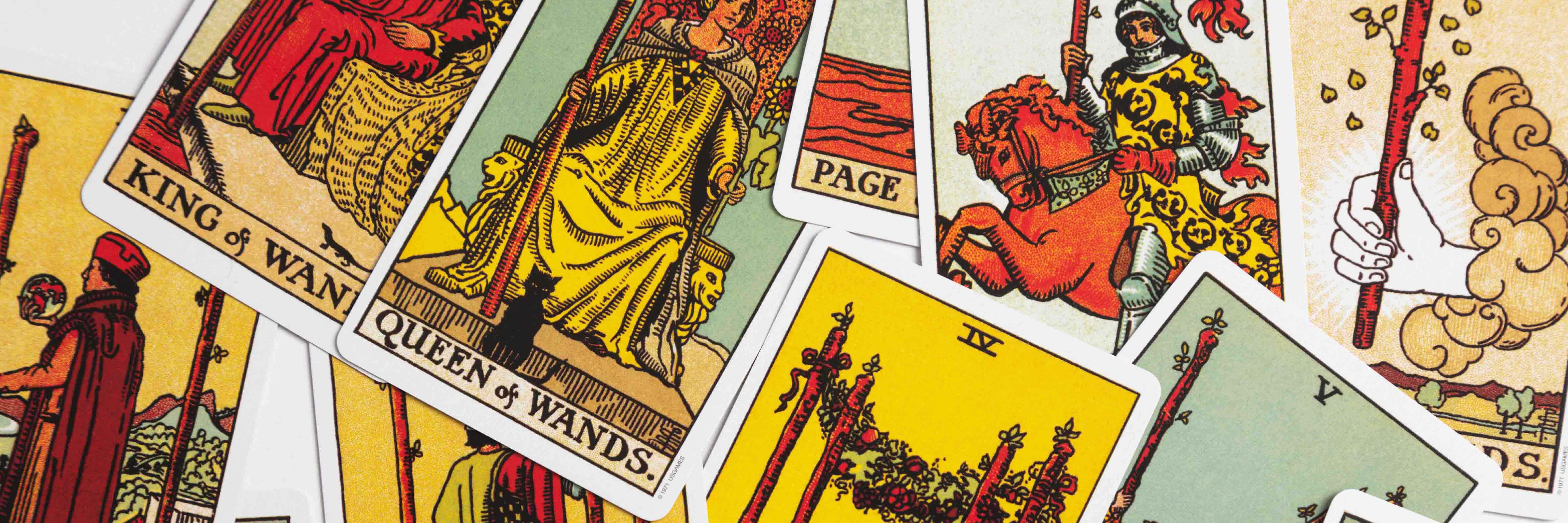 The suit of wands from the Rider Waite tarot deck in a messy layout.