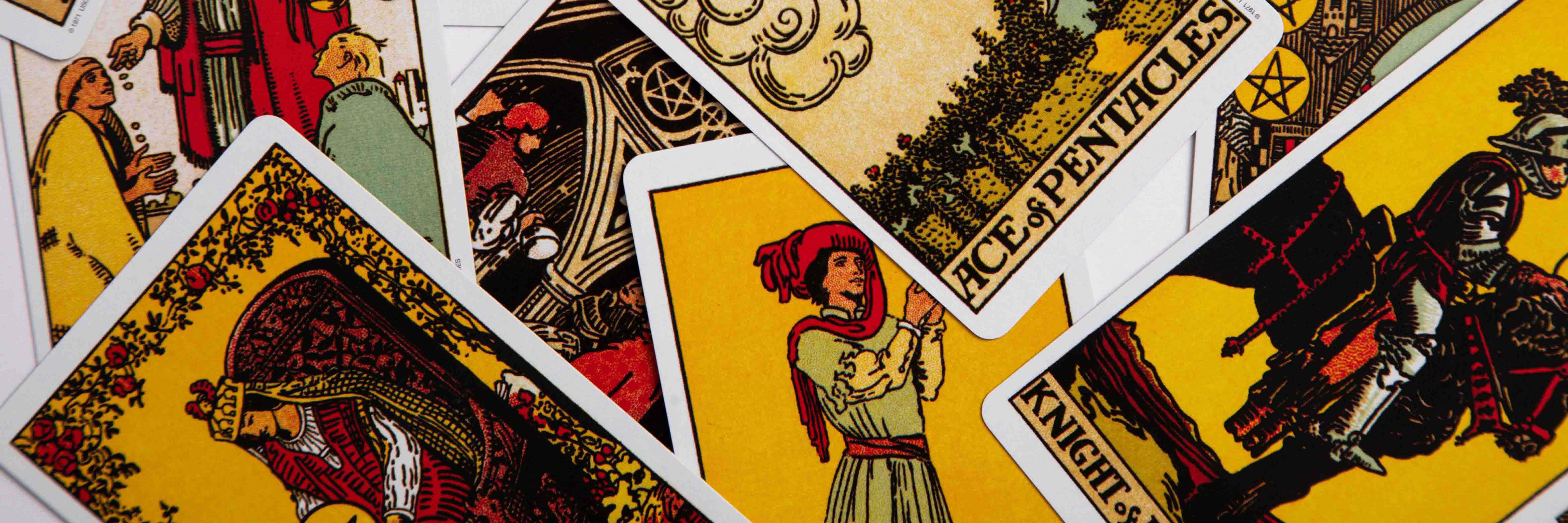 The pentacle suit of tarot in a messy layout.