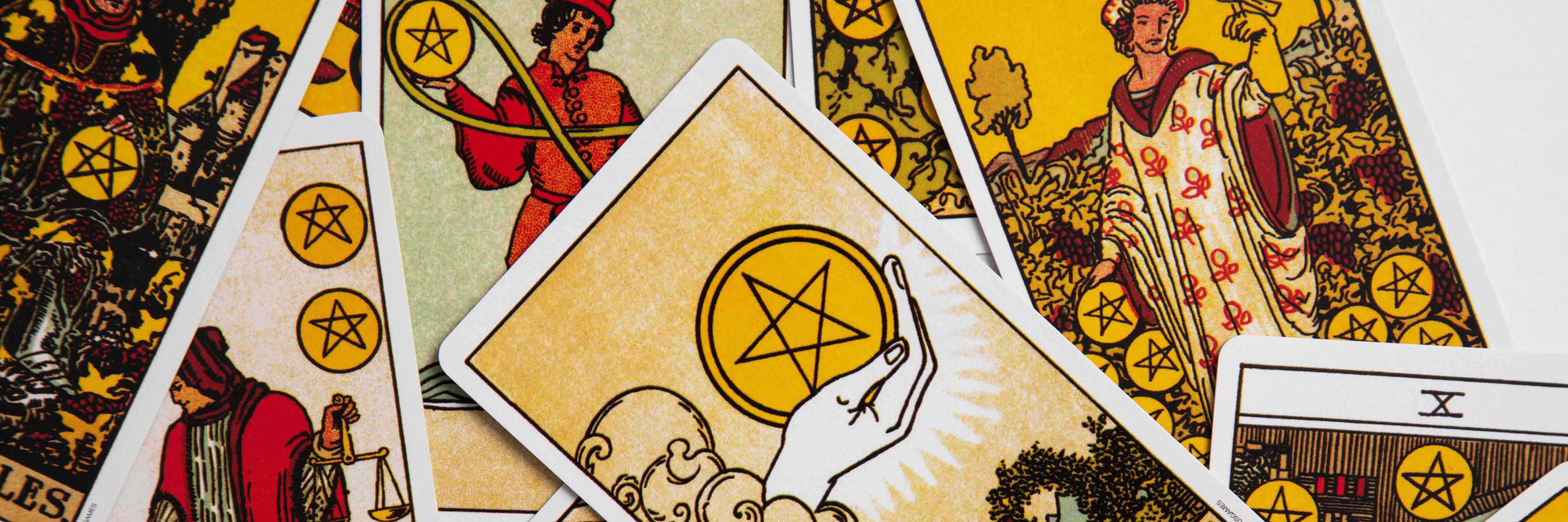 The pentacle suit of tarot in a messy layout.